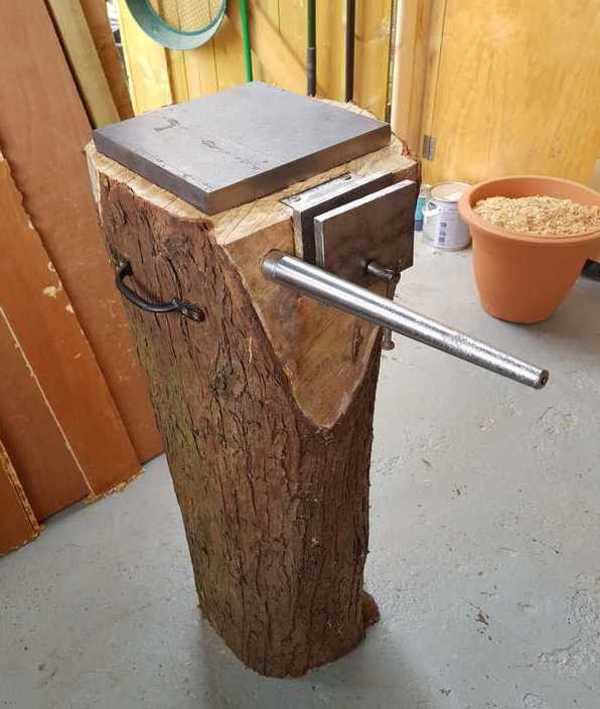 Turning a log into an anvil, vise, and mandrel.