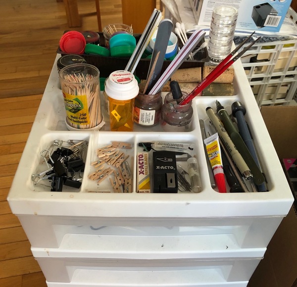 My "homely tools" cart in my shop: toothpicks, safety pins, cotton swabs, binder clips, corks, bottle caps, and more.