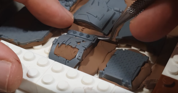 Making a molding box from Legos for casting small parts.